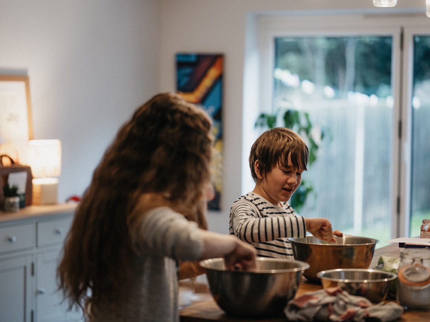girl in white and black striped long sleeve shirt standing beside girl in white and black