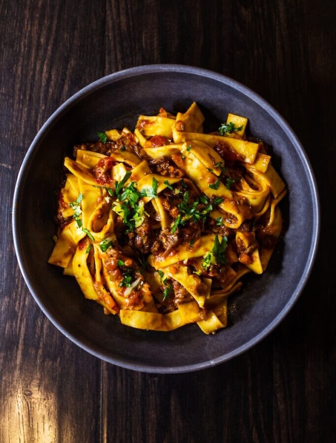 pasta dish on black ceramic bowl