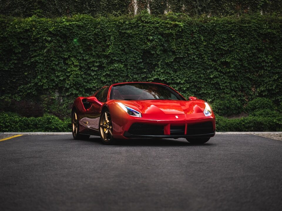 red ferrari 458 italia on road