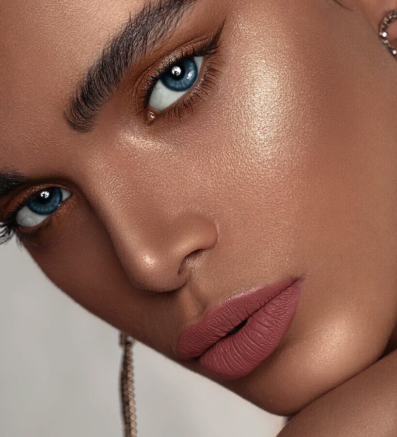 woman with red lipstick and gold hoop earrings