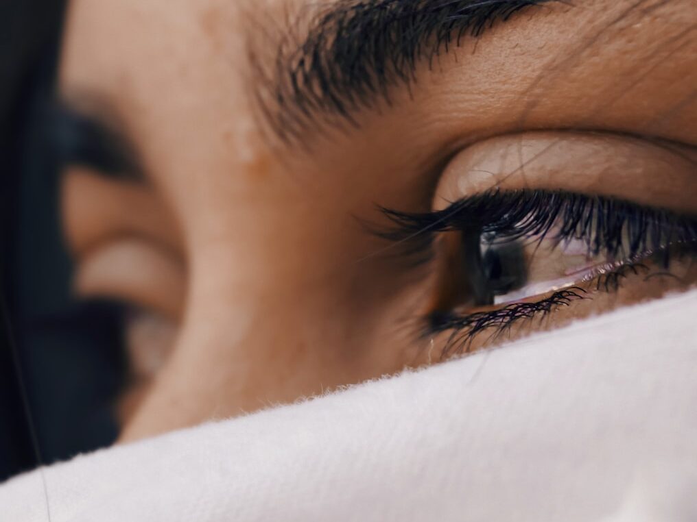 shallow focus of a woman's sad eyes