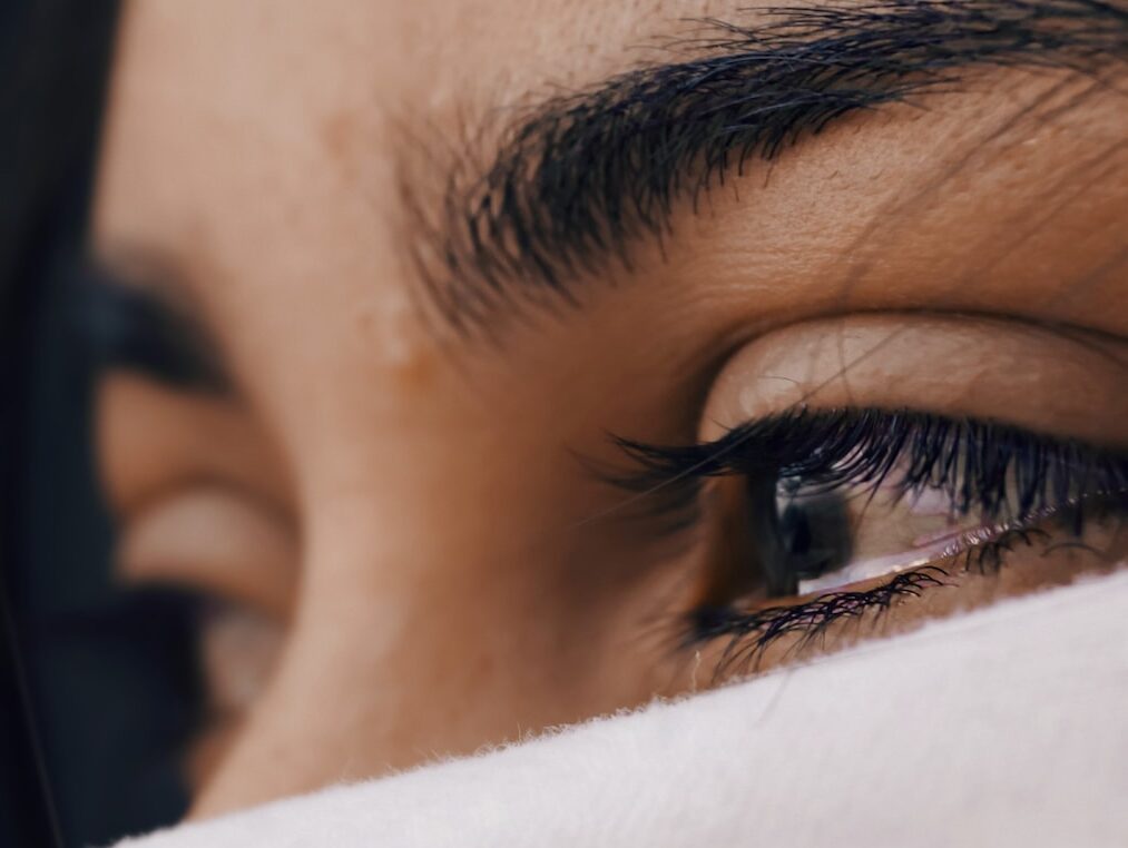 shallow focus of a woman's sad eyes