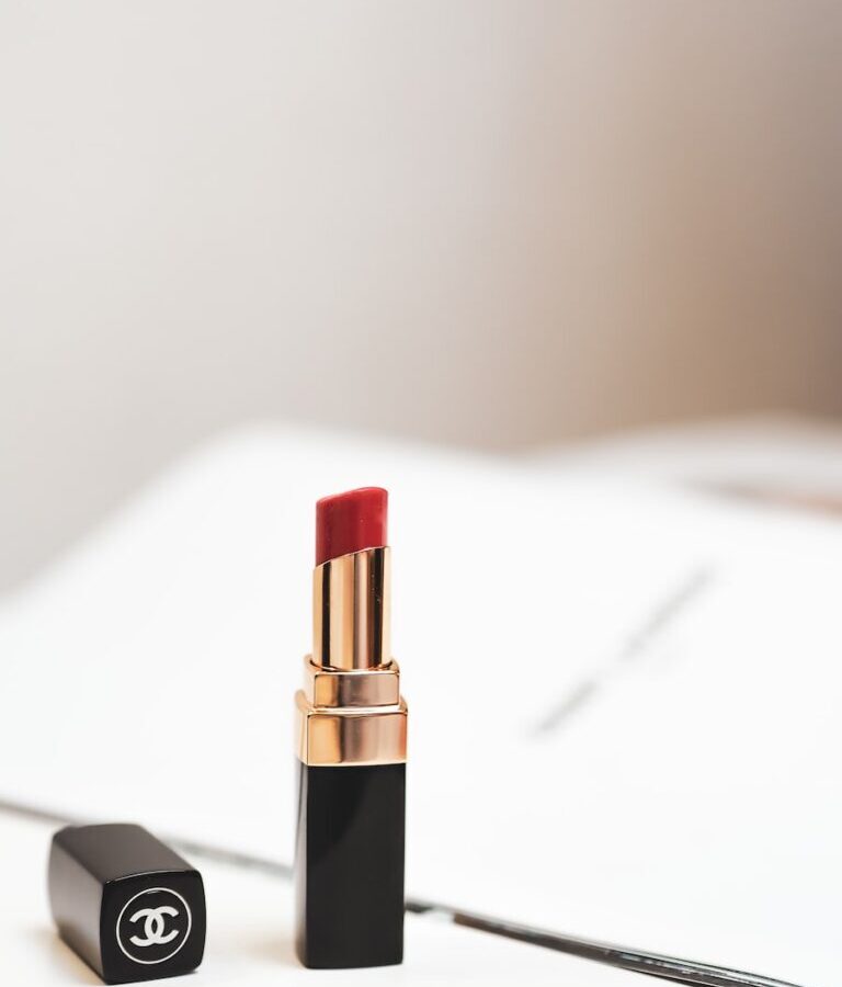red lipstick on white surface