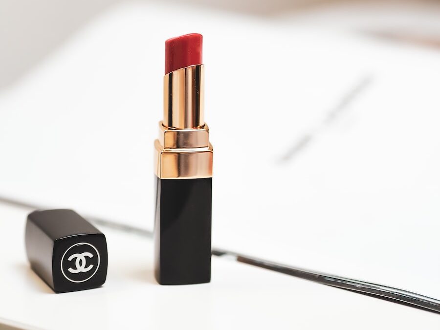 red lipstick on white surface