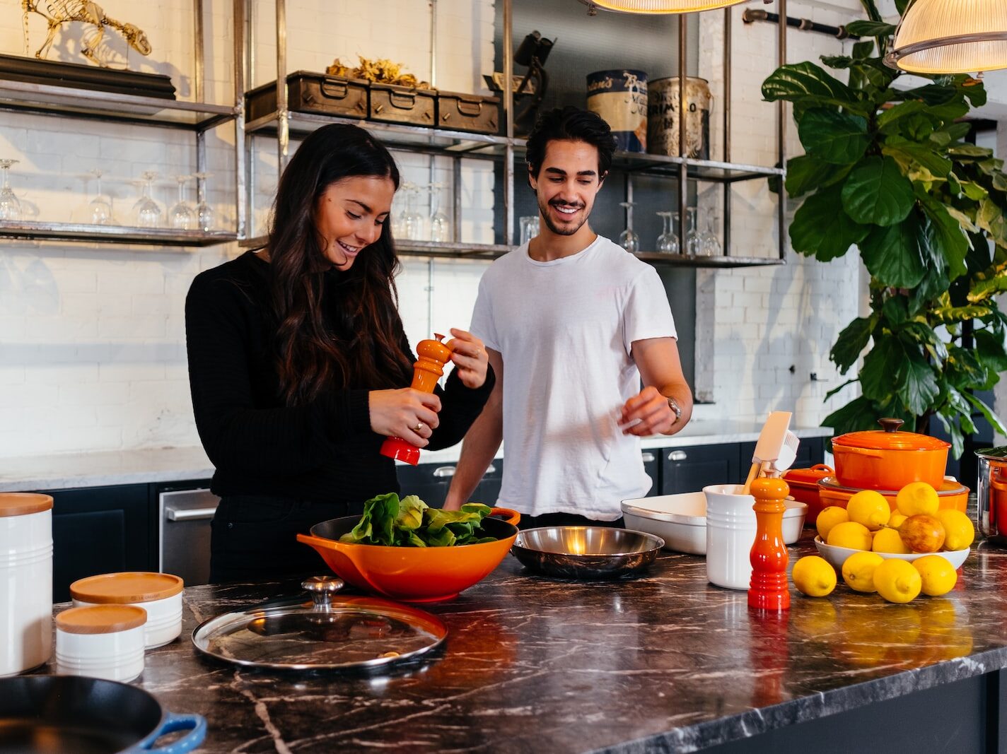 man and woman standing in front of table