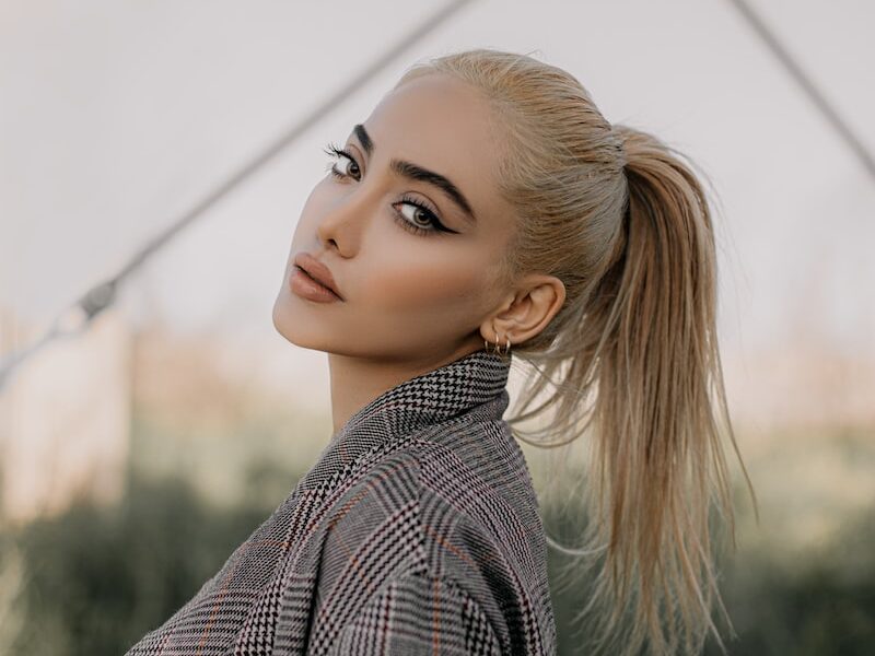 woman in black and white pinstripe dress shirt