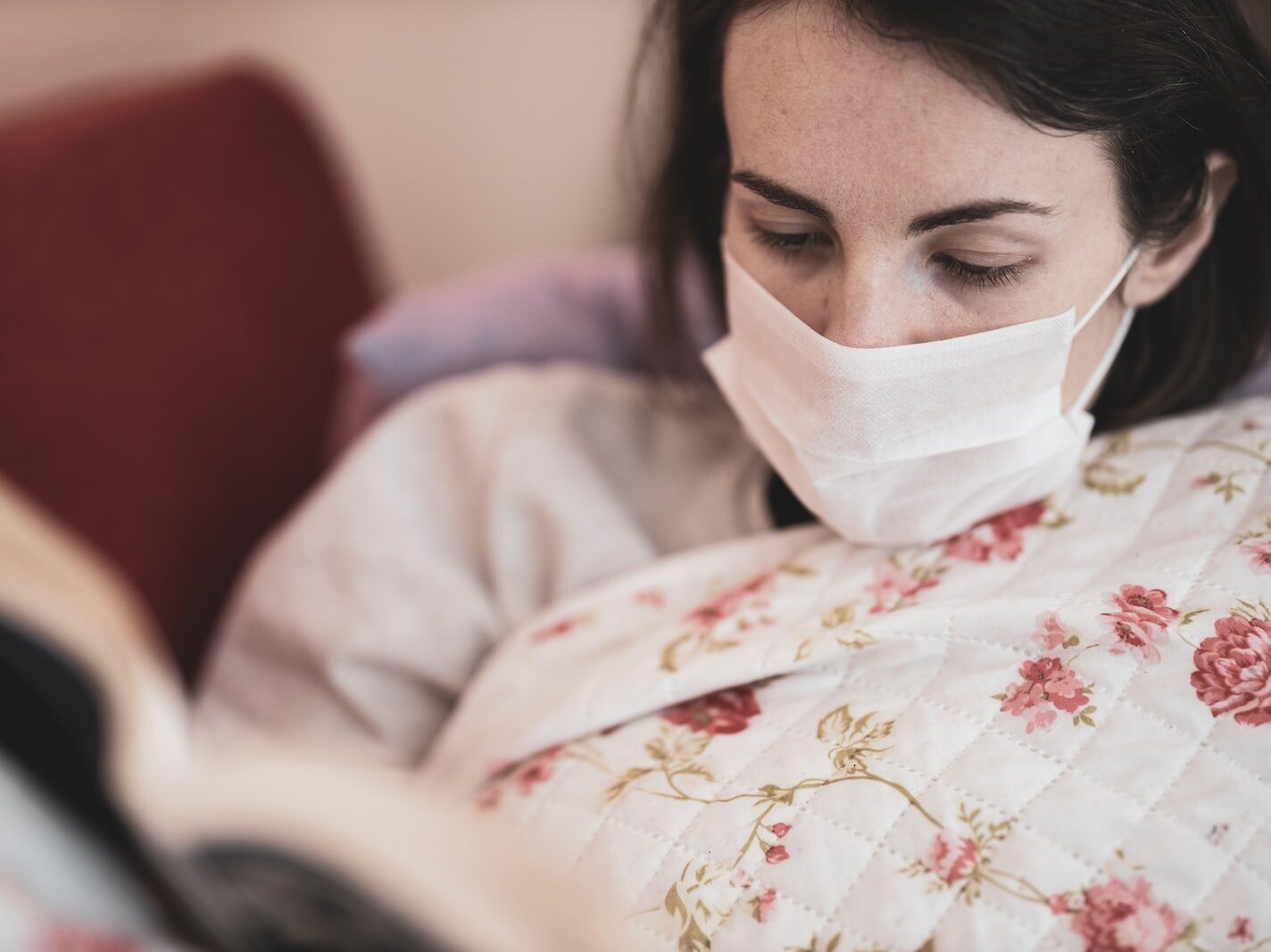 woman in white and red floral hijab