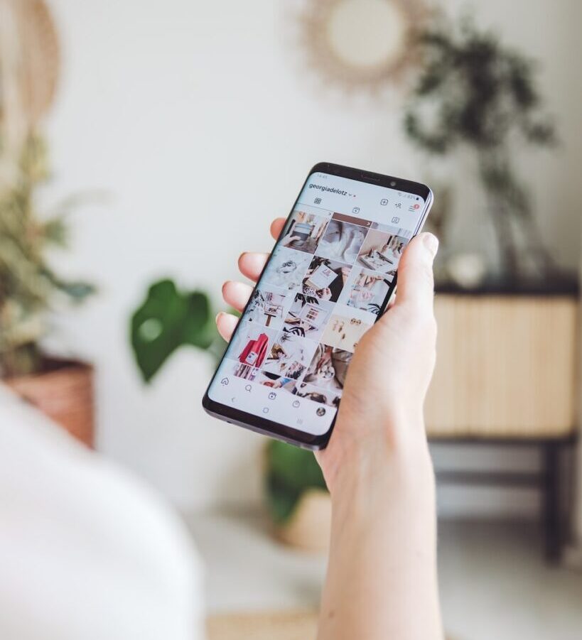 person holding white android smartphone