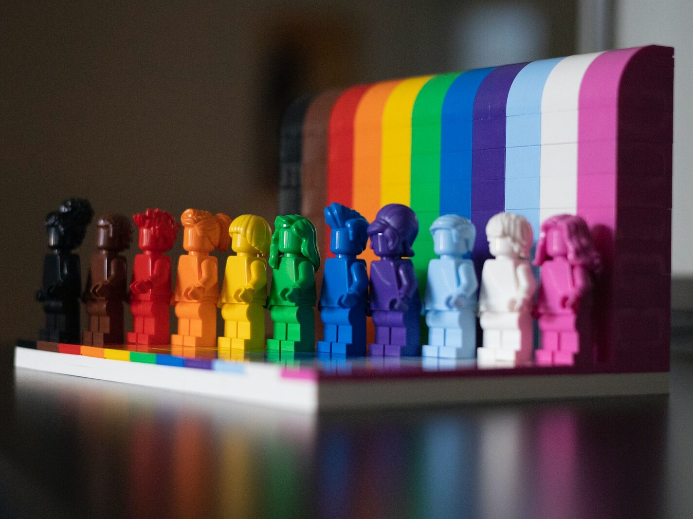 multi colored plastic blocks on white wooden table