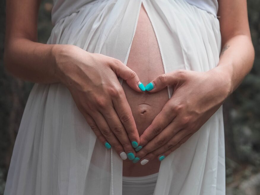 woman holding her belly