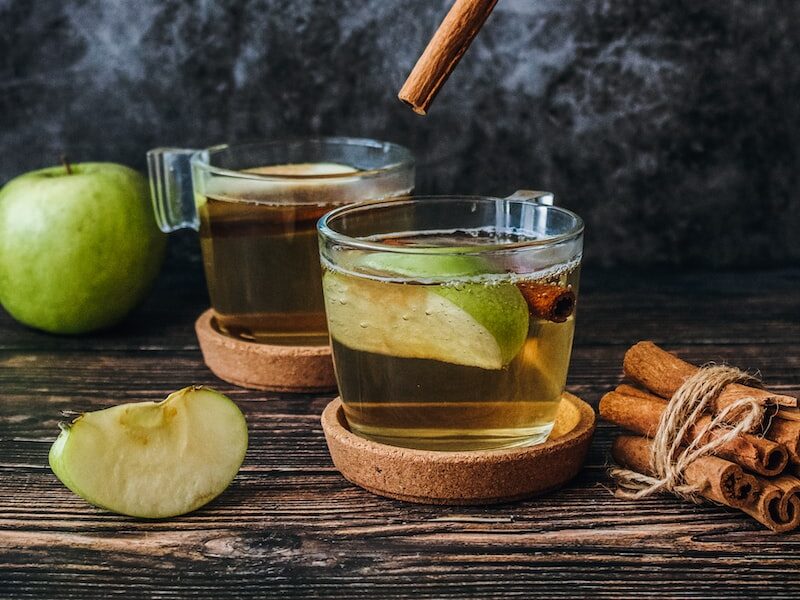 sliced apples on cup with cinamon