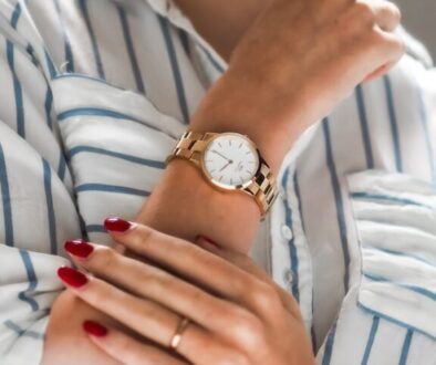 person wearing silver and gold analog watch