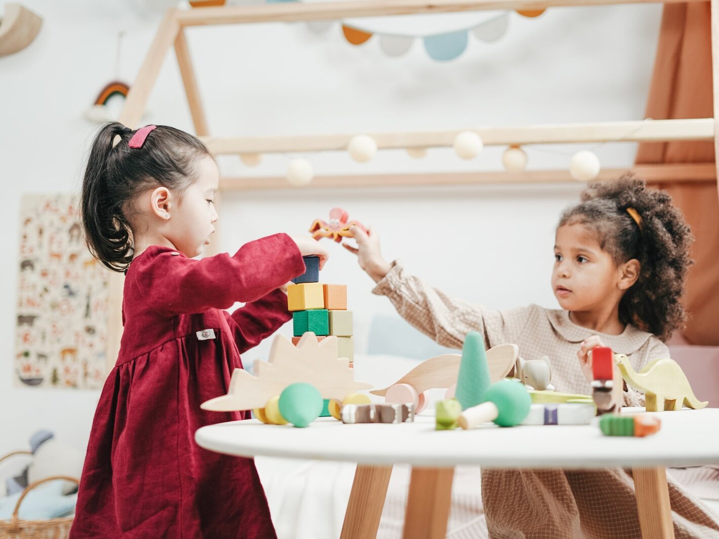 Girl In Red Dress Playing A wooden Blocks