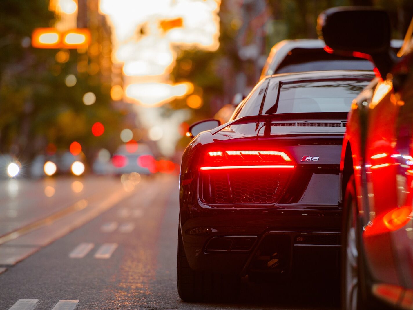 black Audi R8 parked beside road