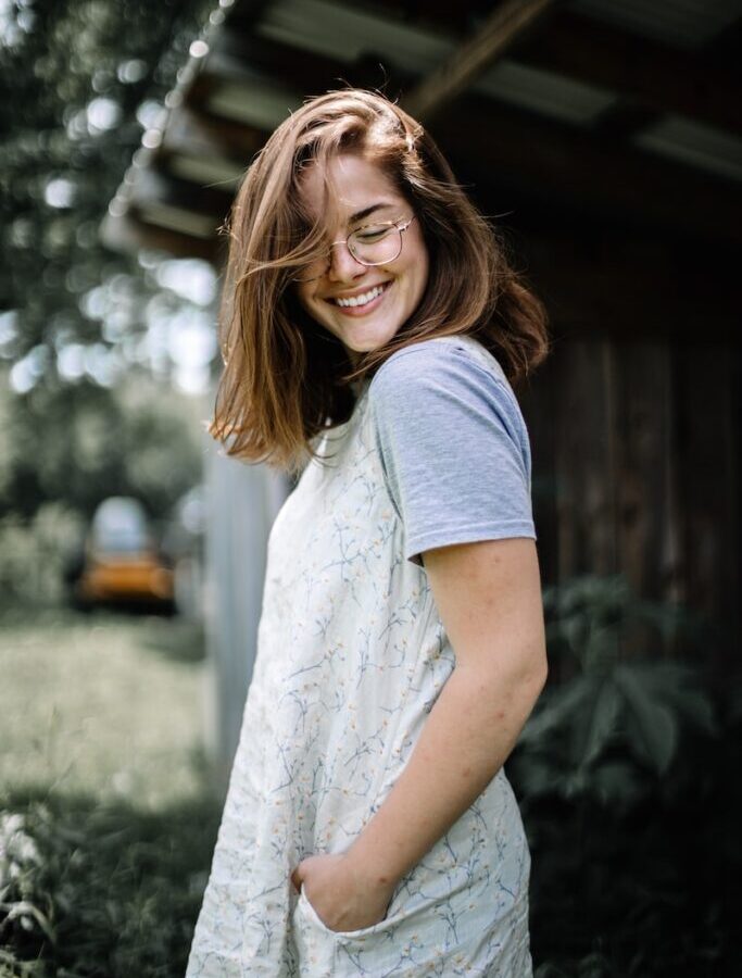 woman standing near house