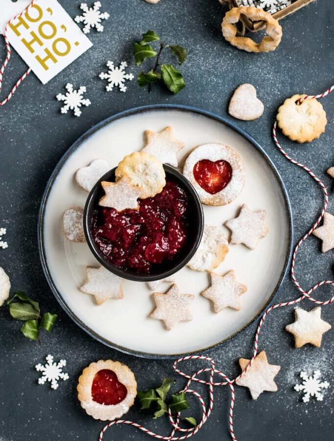 strawberry jam with star biscuits on plate