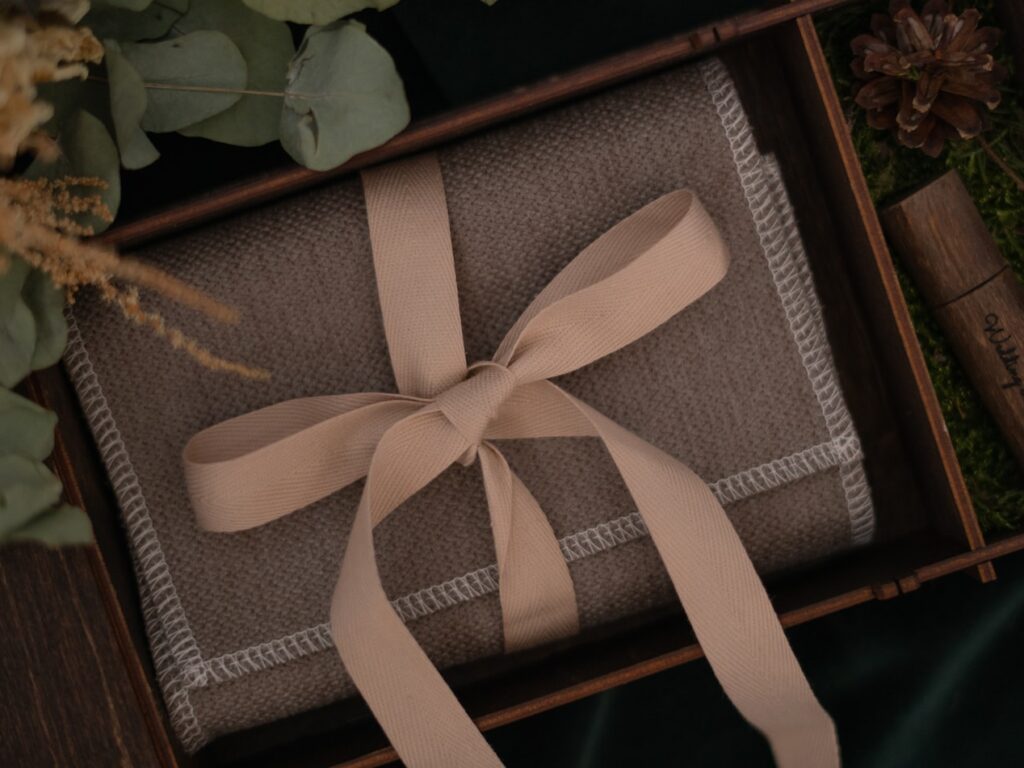 brown and black book on green leaves