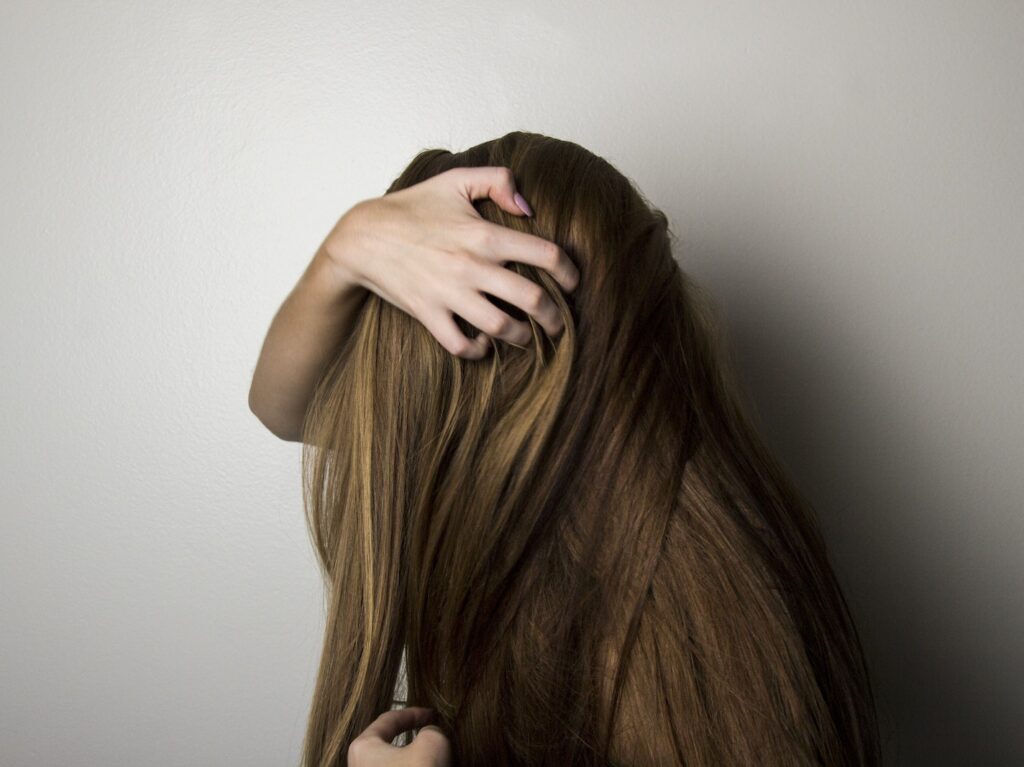 Photo of Woman Covering Face with Her Hair.
