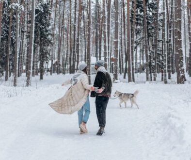 Back View of a Couple Walking on Snow Together