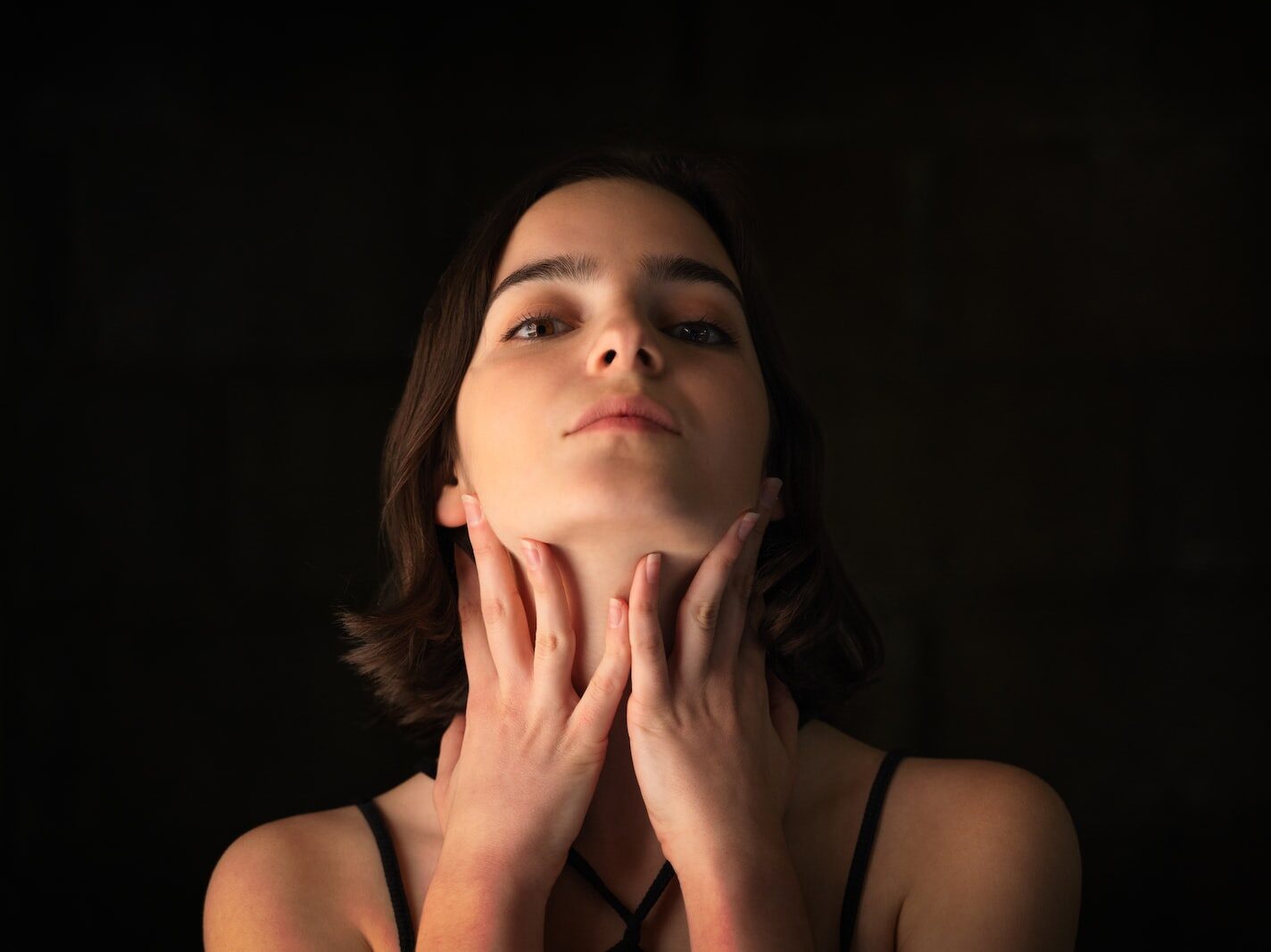 woman in black spaghetti strap top