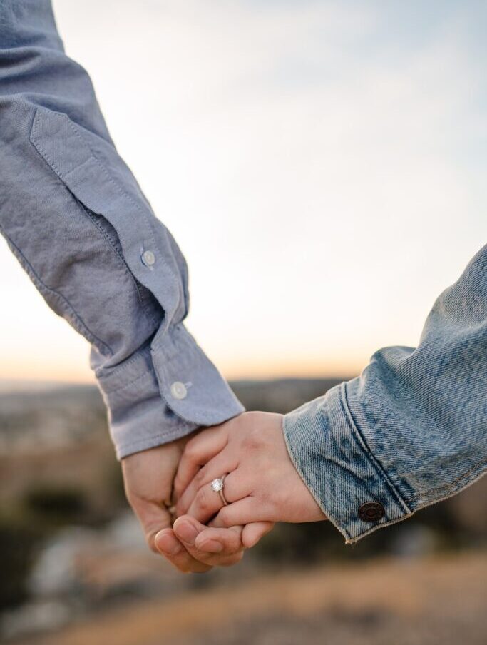 two person holding hands