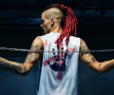 woman in white tank top with red hair