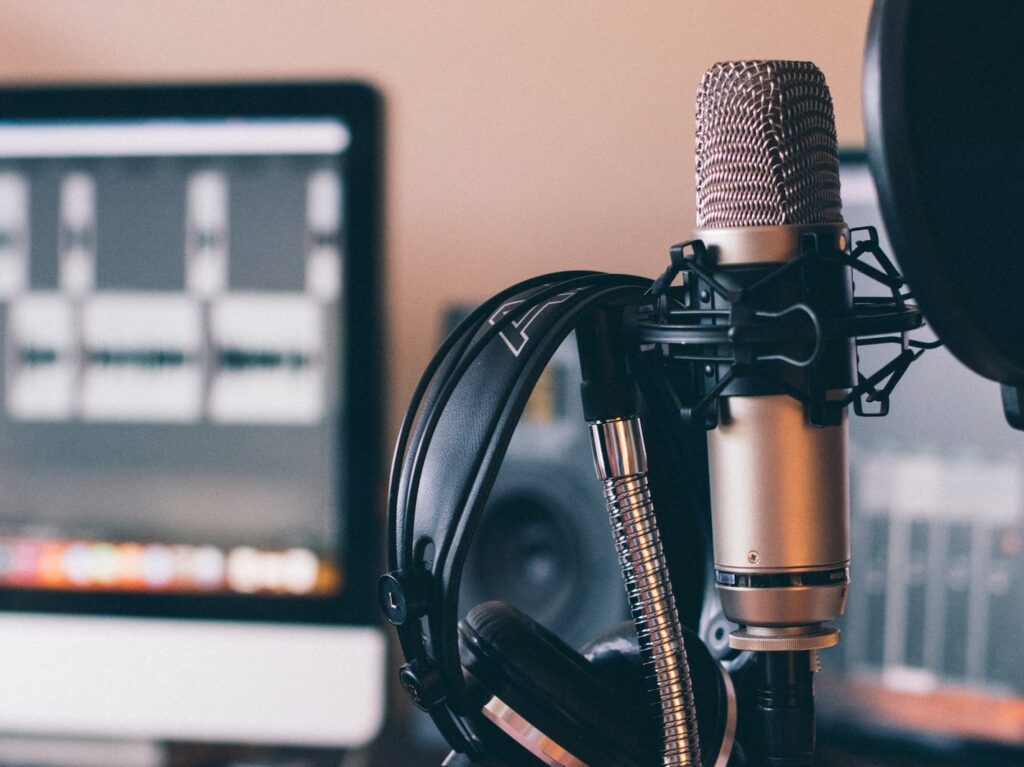 black and silver headphones on black and silver microphone