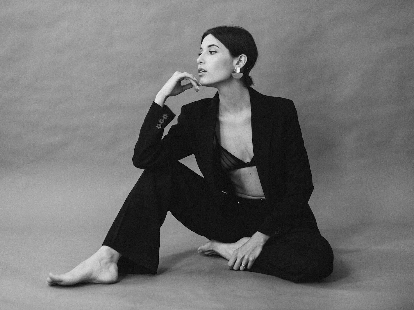 Monochrome Shot of Pretty Woman in Black Coat Posing