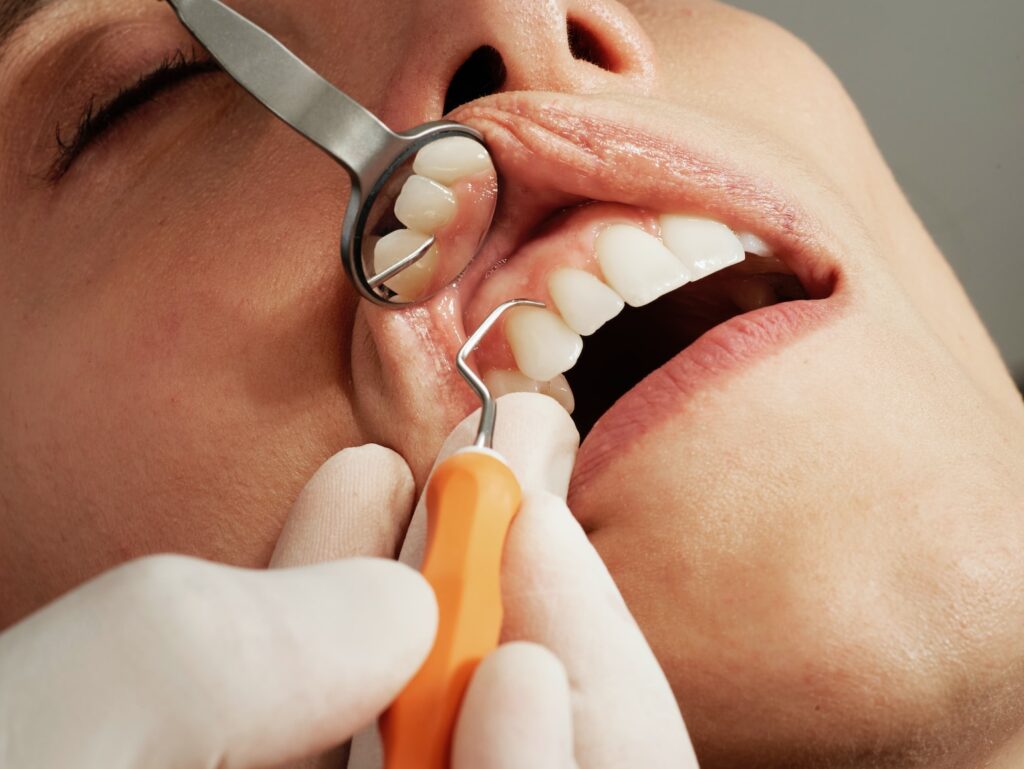 woman with silver and yellow hoop earrings