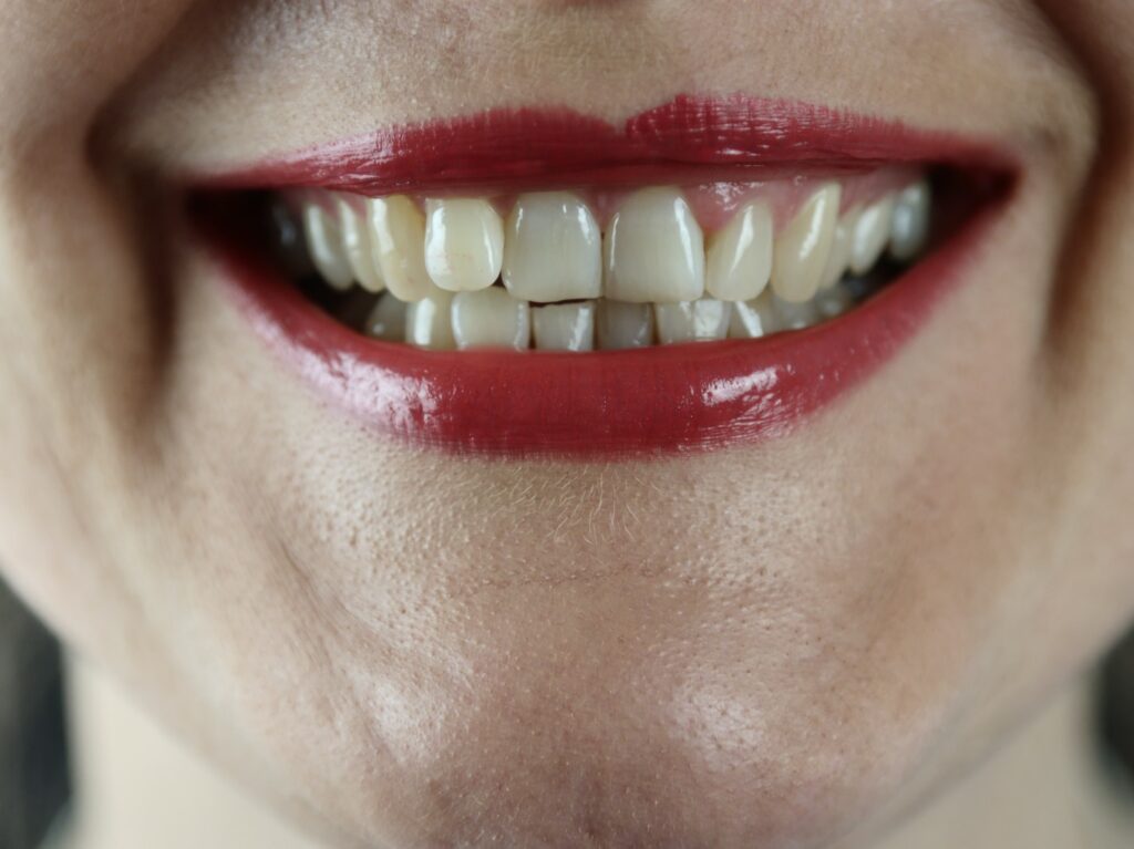 person with red lipstick and red lipstick