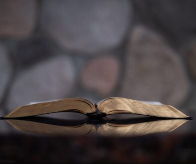 open book on glass table