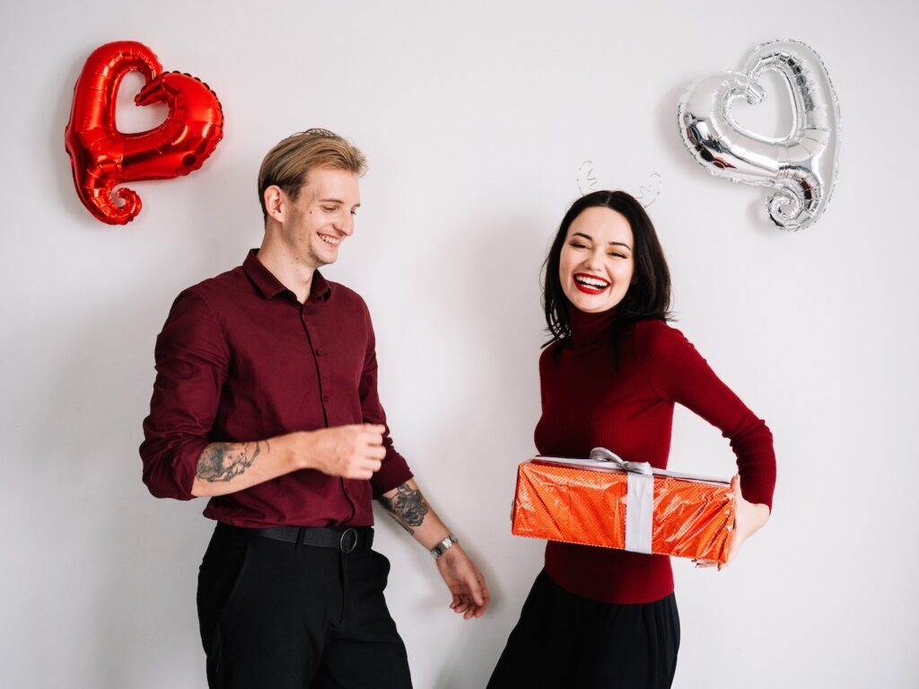 A Woman Giving a Man a Gift