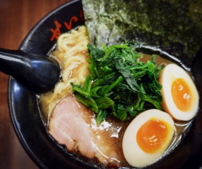 egg and vegetable dish on black ceramic bowl