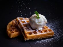 close-up photo of waffle with white ice cream
