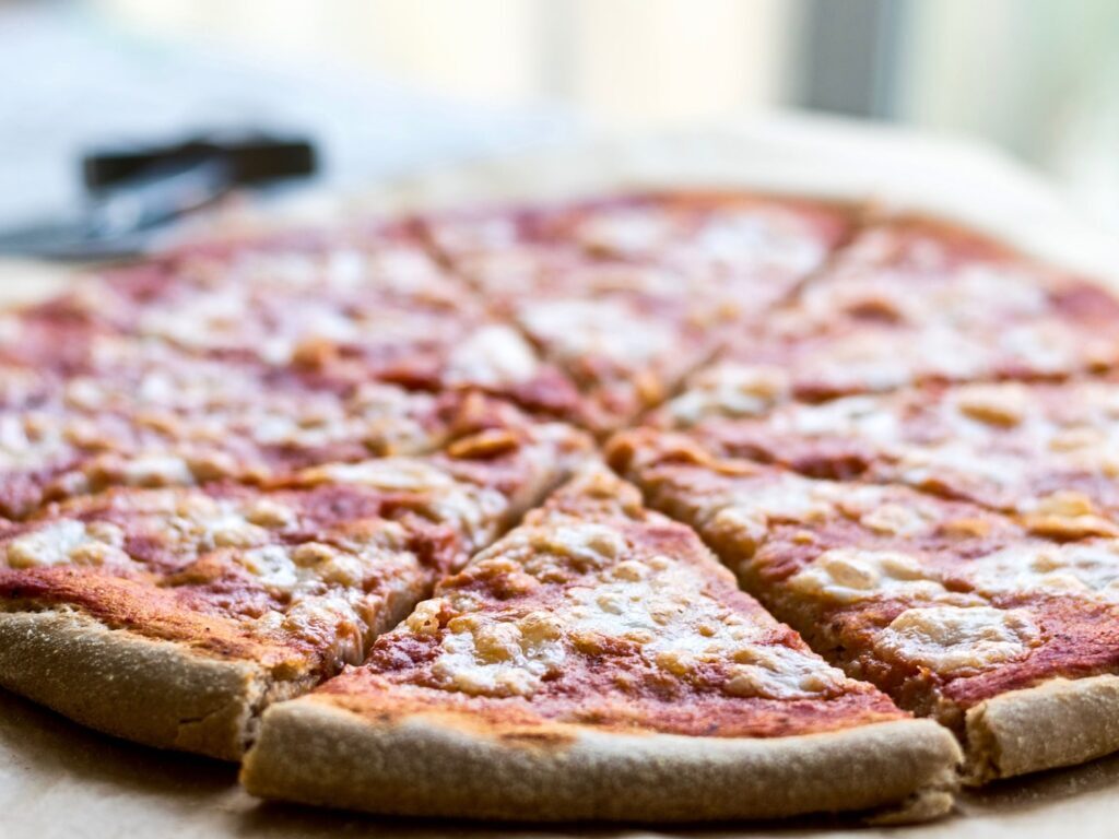 selective focus photography of sliced pizza
