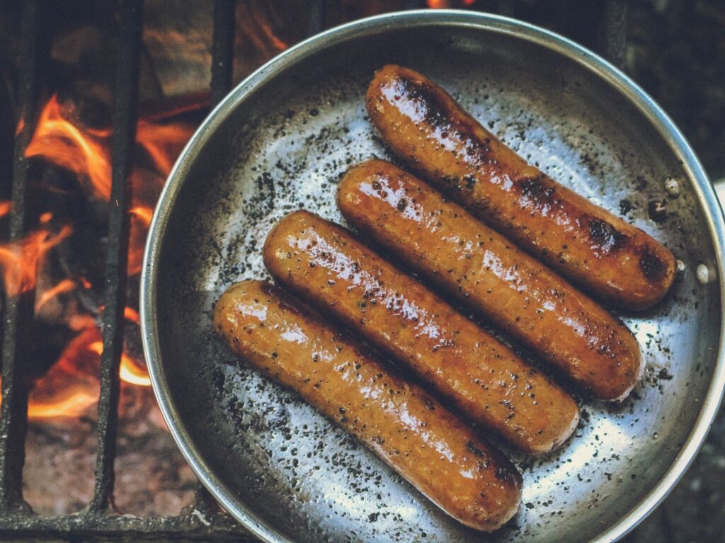 cooked sausage on round grey pan