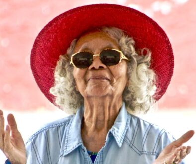 Woman Wearing Red Hat and Sunglasses