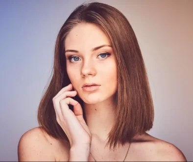 woman with her hand on cheek