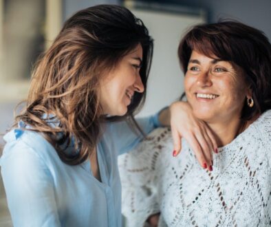 Two Women Smiling At Each Other