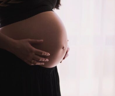woman holding stomach