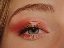 woman with pink and gold eyeshadow makeup