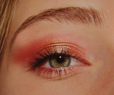 woman with pink and gold eyeshadow makeup