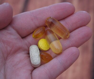 person holding medication pills