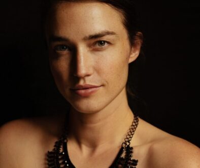 a woman with a necklace on her neck