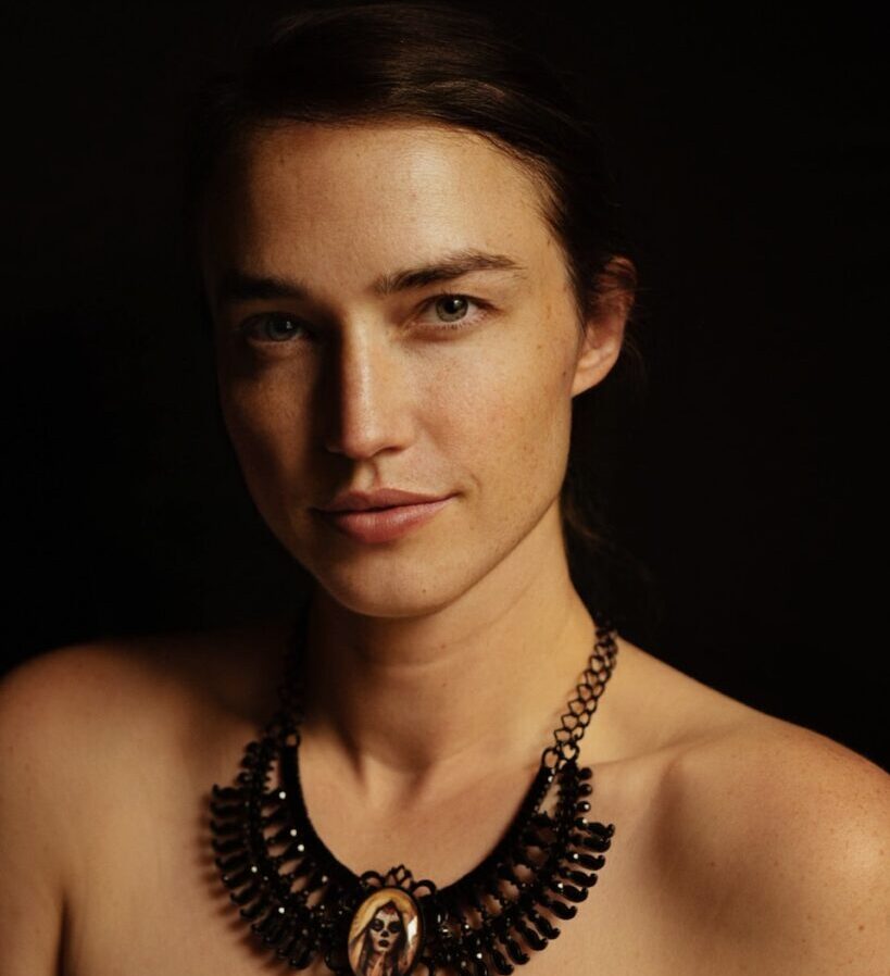 a woman with a necklace on her neck