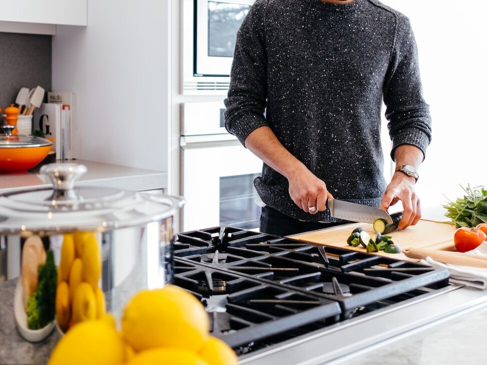 man cutting vegetables