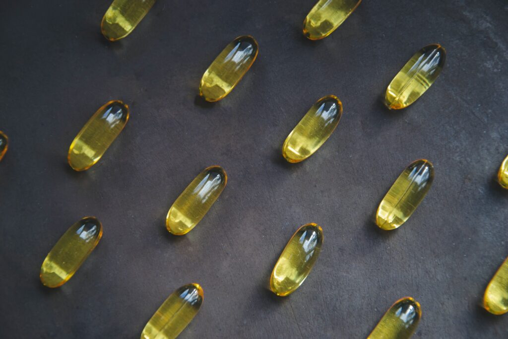 a bunch of yellow pills sitting on top of a table