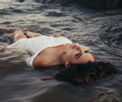 woman relaxing on body of water
