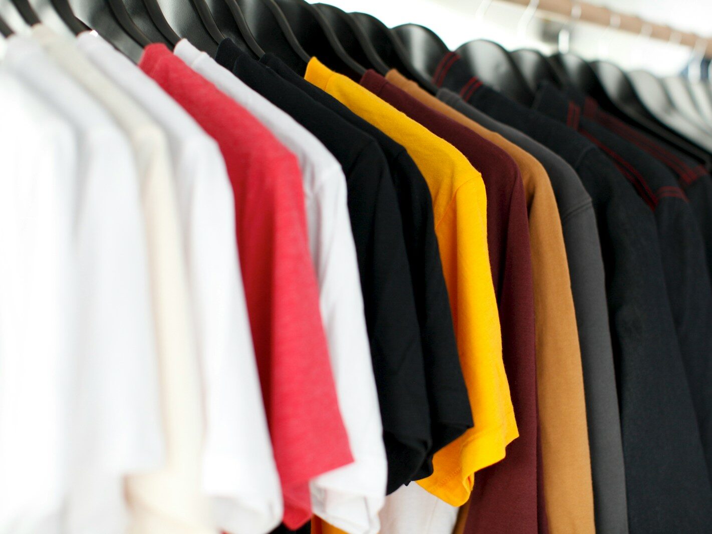 closeup of hanged shirts on rack