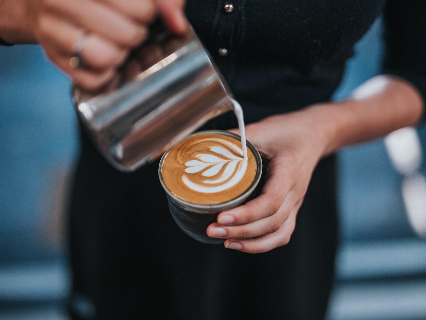 person holding coffee with latte cup